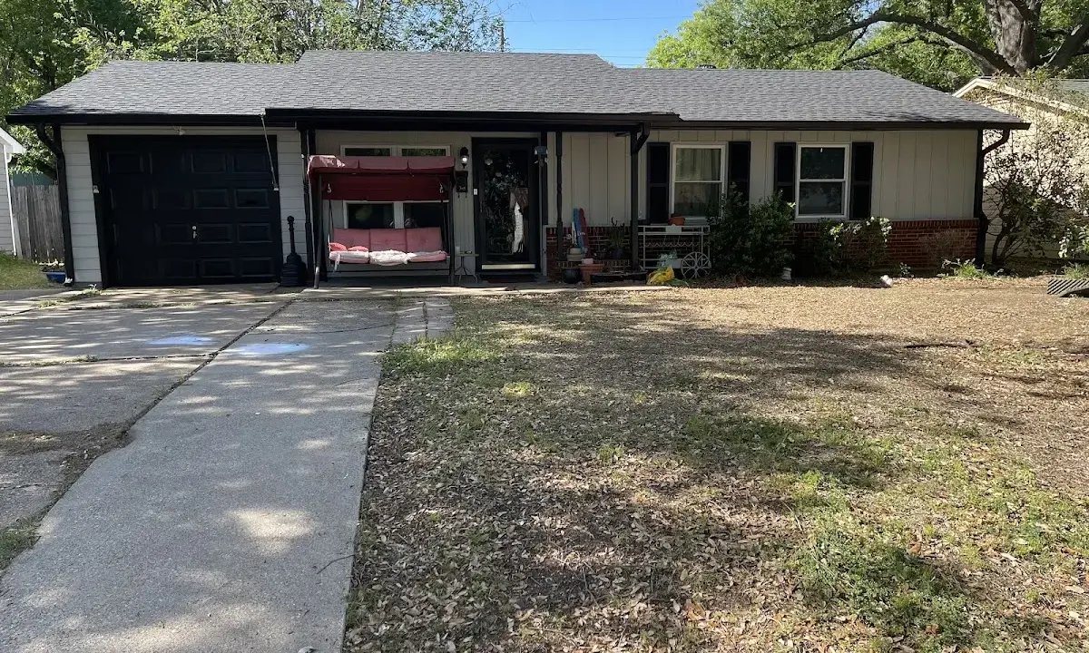 Hail Damage Roof Repair crew at work on a residential roof in Titusville
